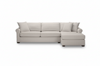Beige sofa with two cushions on a white background