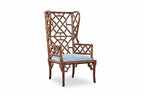 Decorative chair with bamboo  lattice backrest and light blue cushion on a white background