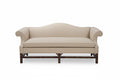 Blue sofa with wooden legs on a white background