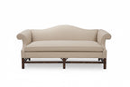 Blue sofa with wooden legs on a white background