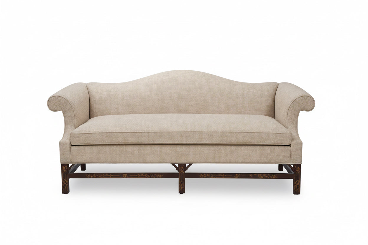 Blue sofa with wooden legs on a white background
