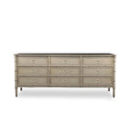 Wooden dresser with multiple drawers on a white background