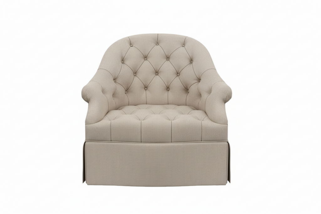 Blue tufted armchair on a white background