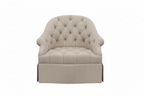 Blue tufted armchair on a white background